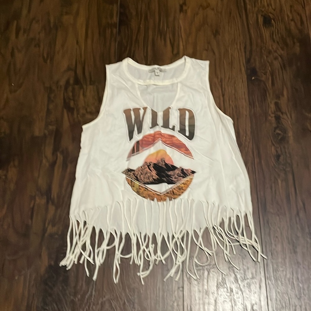 So cute top with fringes on bottom showing a little bit of belly